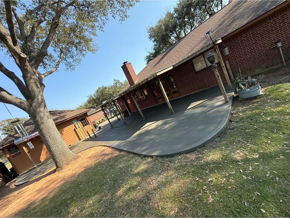 New concrete patio poured in Tomball, TX. Great back porch area to relax and entertain.
