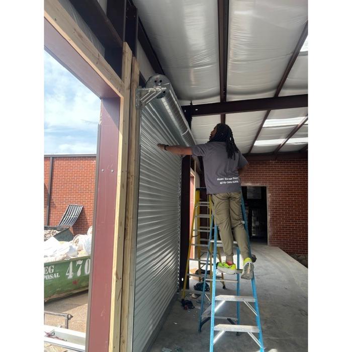 Garage door installation in progress by Hawk Garage Doors team serving the Atlanta, GA area — Hawk Garage Doors