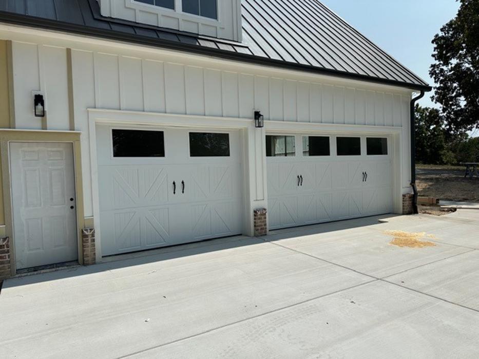 Two-car gray raised-panel garage door on a residential home in the Atlanta metro area — Hawk Garage Doors