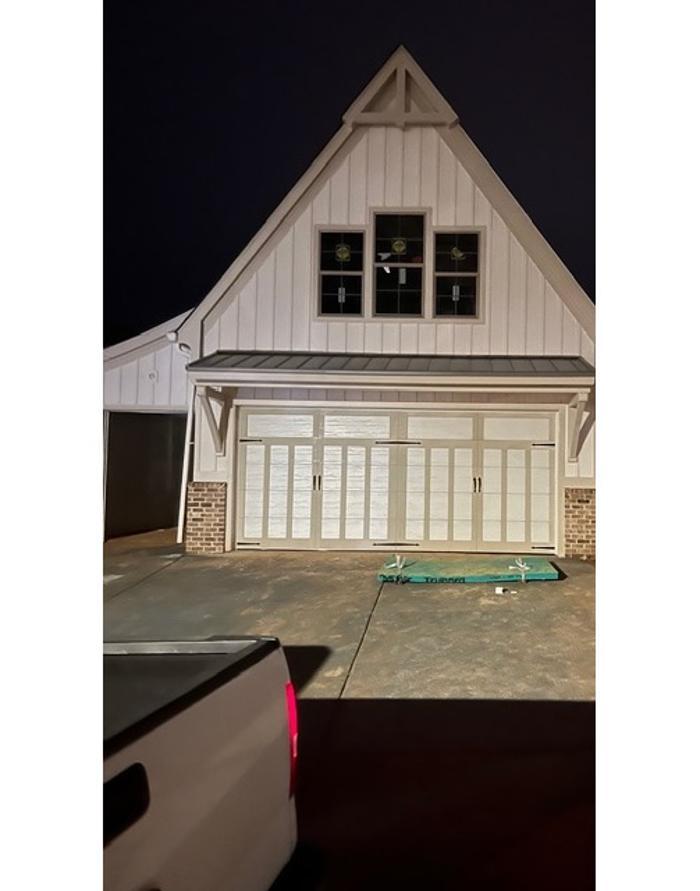 Classic raised-panel garage door on a traditional home exterior — Hawk Garage Doors