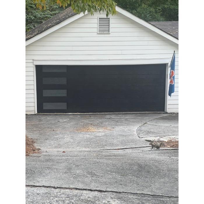 Dark charcoal single-car garage door with clean modern panel design — Hawk Garage Doors