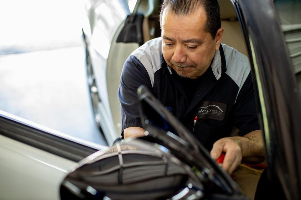 Staff member Santiago at Japanese Auto Repair working on a customer's vehicle repairs