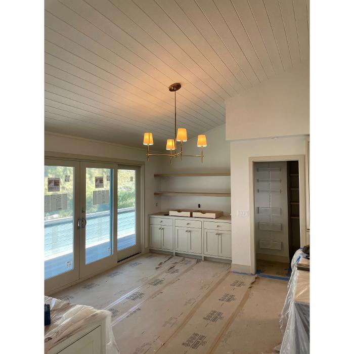 Chandelier and recessed lighting install during a San Diego remodel.