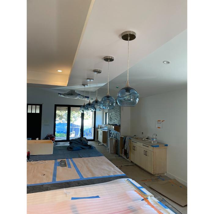 Row of globe pendant lights installed by Cbass Electric, San Diego.