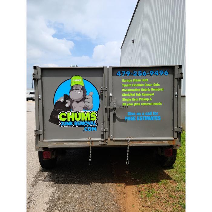 Branded Chums Junk Removal dump trailer serving customers throughout Northwest Arkansas.