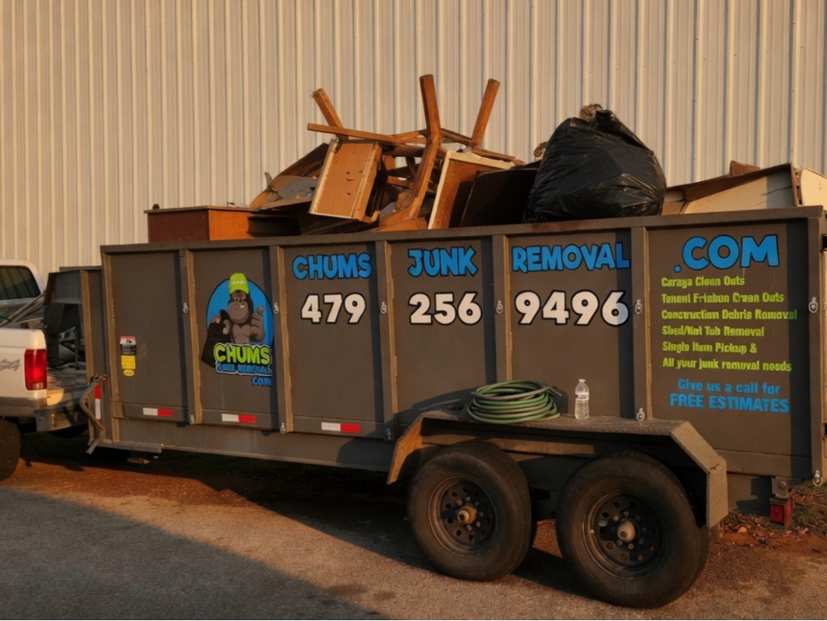 Chums Junk Removal dump trailer loaded with furniture and household junk for removal.