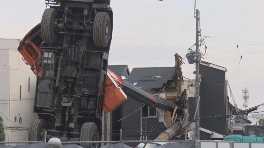 Crane boom falls on home in Japan
