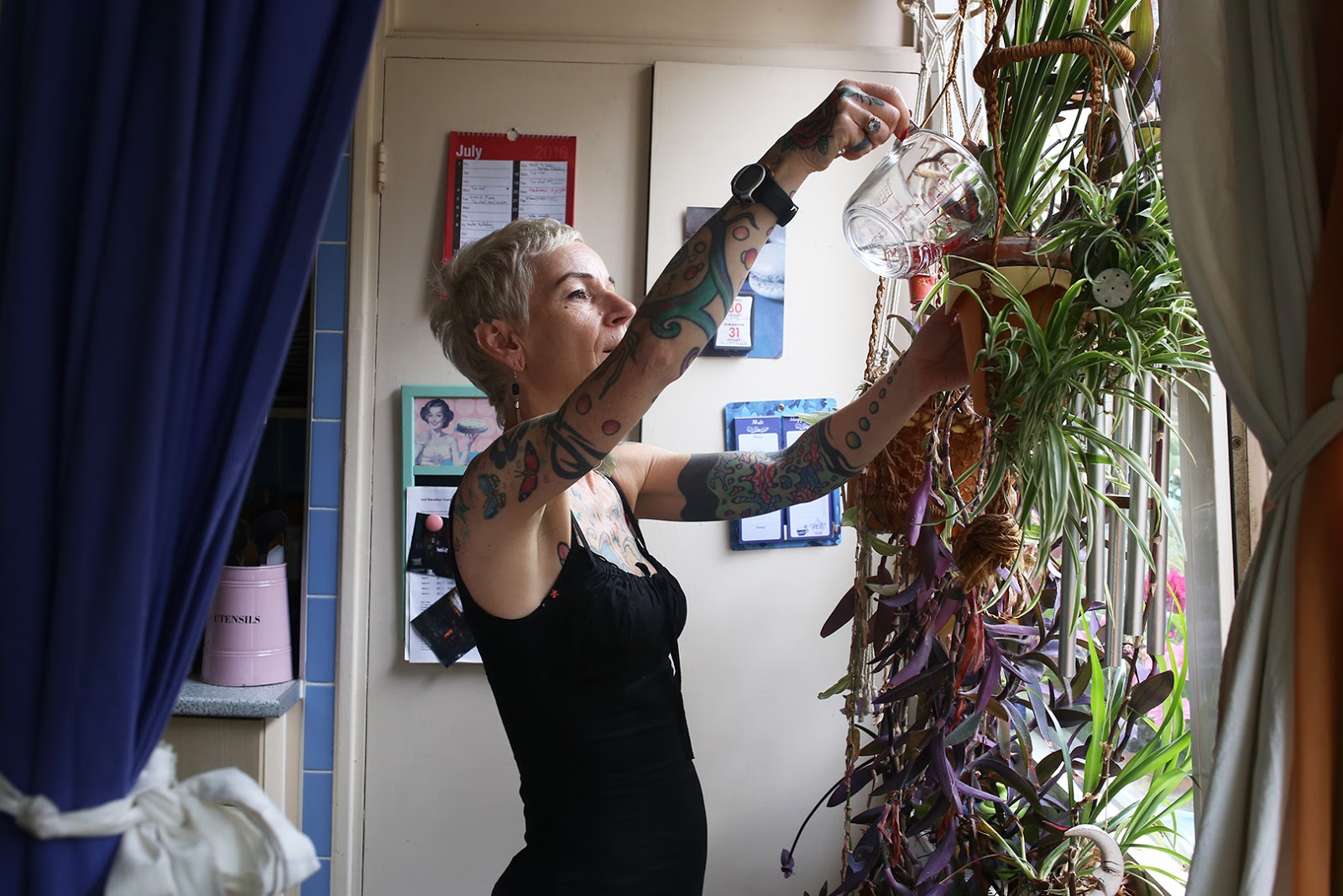 anne-women-with-tattoos-watering-plants