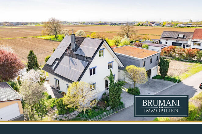 BRUMANI | Modernes Einfamilienhaus mit hochwertigem Anbau, Doppelgarage und Pool in Buggingen