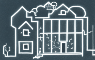 A darkened house with a candle glowing in the window