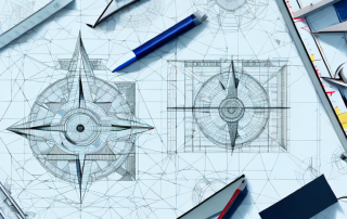 A drafting table with architectural tools like a ruler