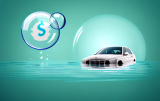 A car partially submerged in water with a protective bubble around it