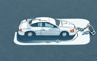 An empty parking space with a broken lock on the ground