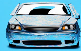 A car half painted and half wrapped in foil