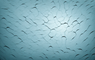 A plastic surface with visible scratches on one side