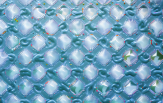 Various plastic mats with different polishing tools and products nearby