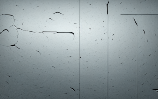 A car door panel with visible scratches and various tools like a sanding block