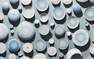A collection of ceramic pottery pieces in various stages of polishing