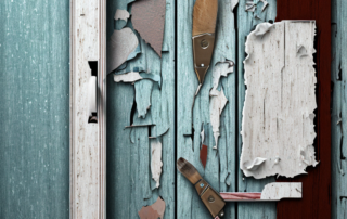 An old wooden door with patches of peeling paint