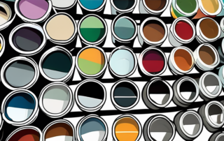 Various car paint cans with different colors and a magnifying glass focusing on a color code label