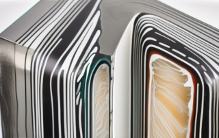 A cross-section of stainless steel coated with layers of zinc phosphate and epoxy resin primer