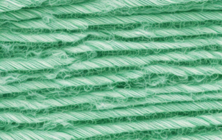 Various stages of hemp fibers being processed and woven into fabric