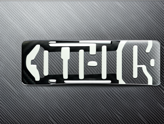 A car license plate with a carbon fiber texture