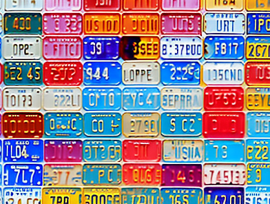 Various small and diverse license plates from around the world