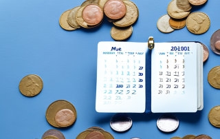 A wallet with coins and a life insurance policy document inside