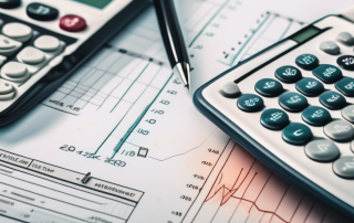 A calculator placed on top of a life insurance policy document
